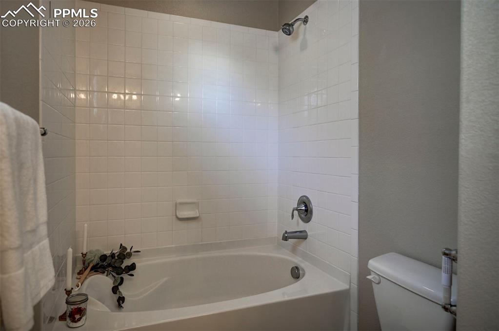 Large bathtub/shower perfect for soaking.