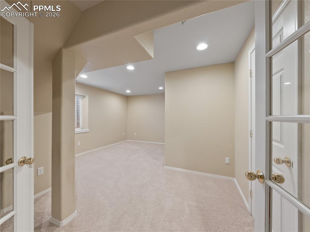 Finished below grade area/flex room featuring light colored carpet and recessed lighting