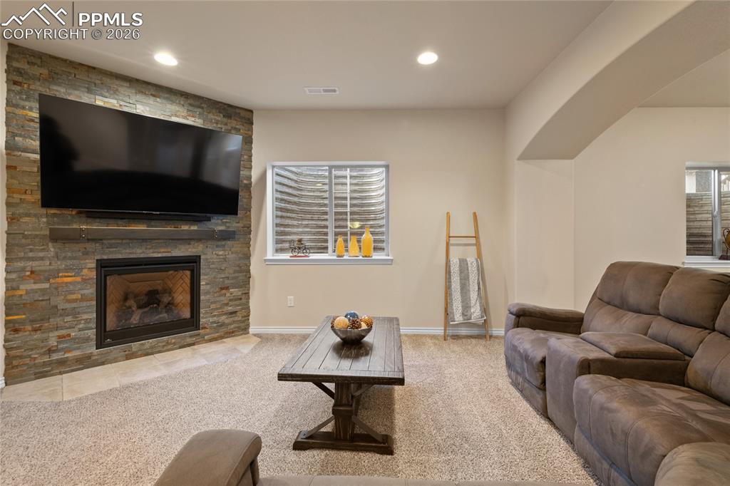 Lower level family room with gas fireplace. 