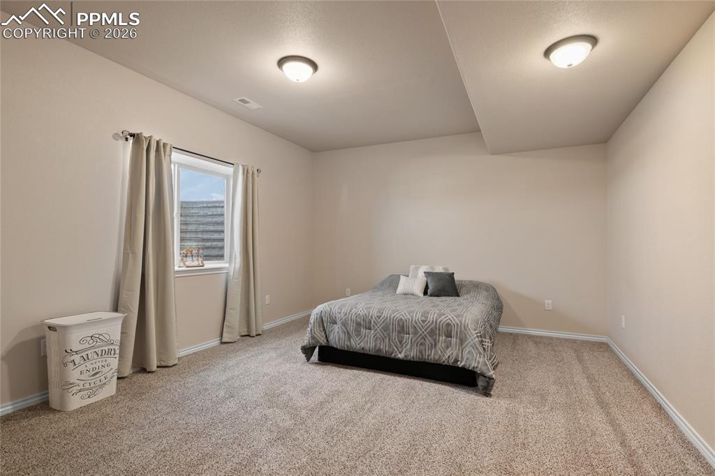 Lower level secondary suite with ensuite bath.(Bedroom #6.)