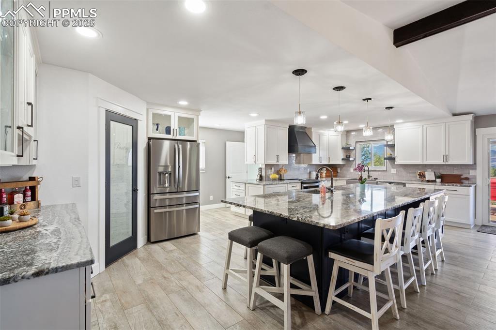 Loads of cabinet and counter space in this recently remodeled kitchen (2024) with a roomy corner walk in pantry!