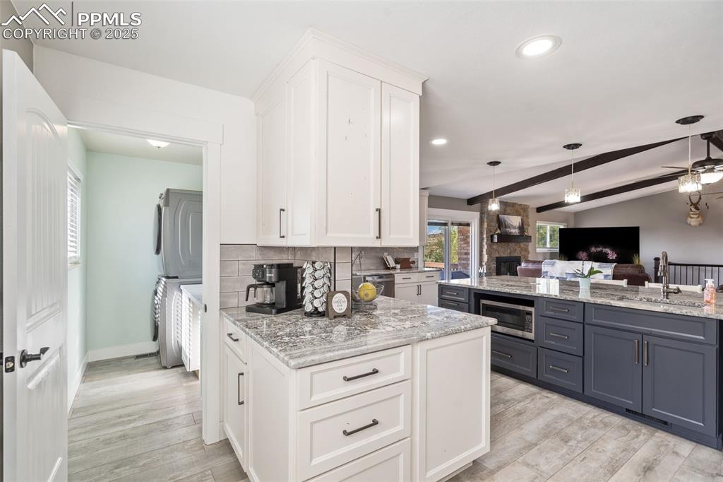 Coffee bar area with more cabinets and check out the microwave in the large island!