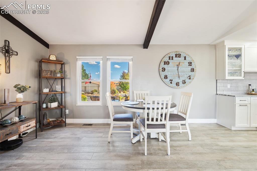 Dining area right off the open kitchen and living room. Perfect entertaining space with this open concept floor plan.