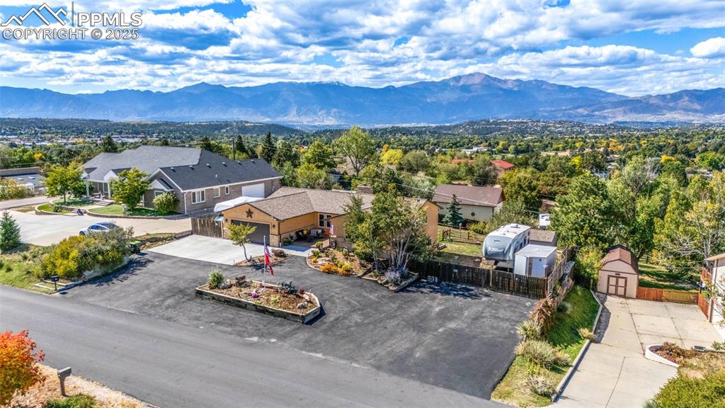 Great curb appeal and low maintenance with a large paved driveway & parking area!