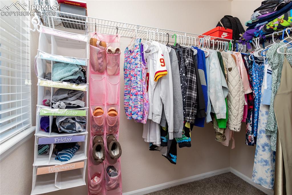 Walk in closet in secondary bedroom