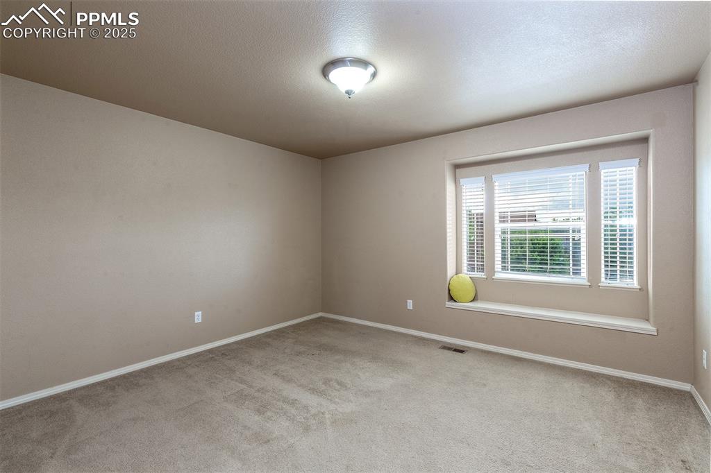 Empty room with carpet flooring