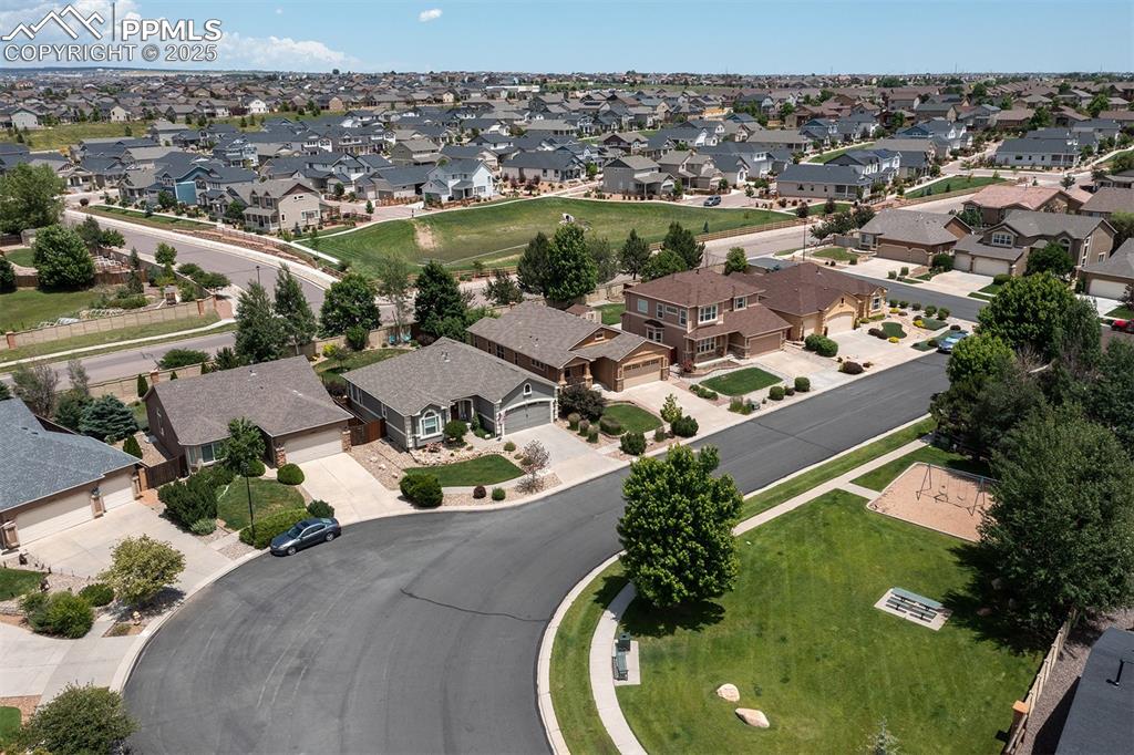 Aerial overview of property's location with nearby suburban area