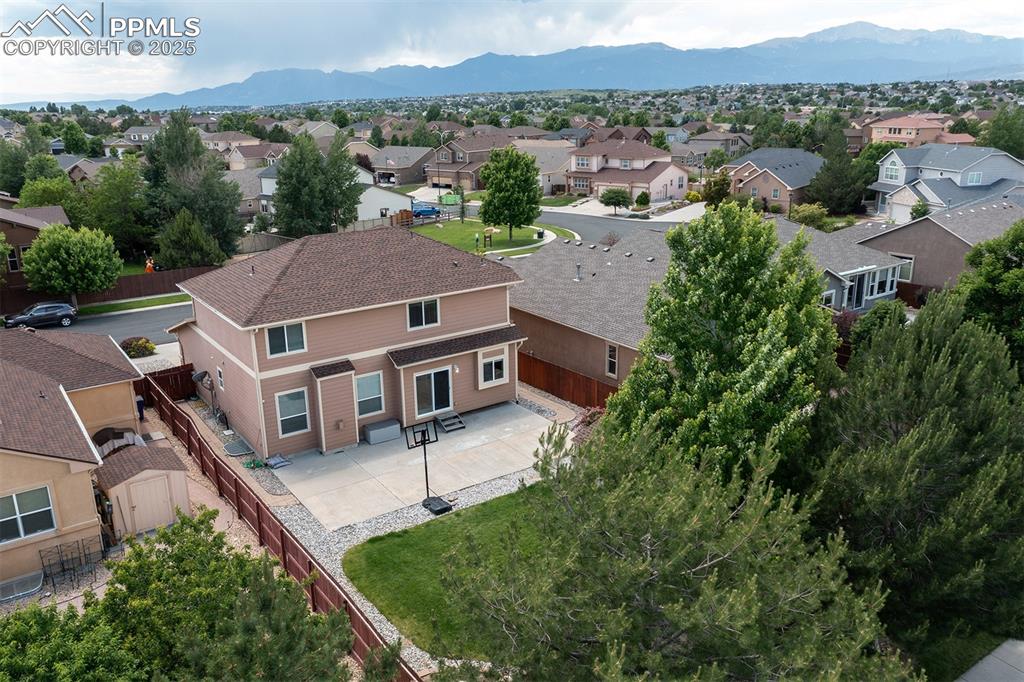 Aerial view of residential area featuring mountains