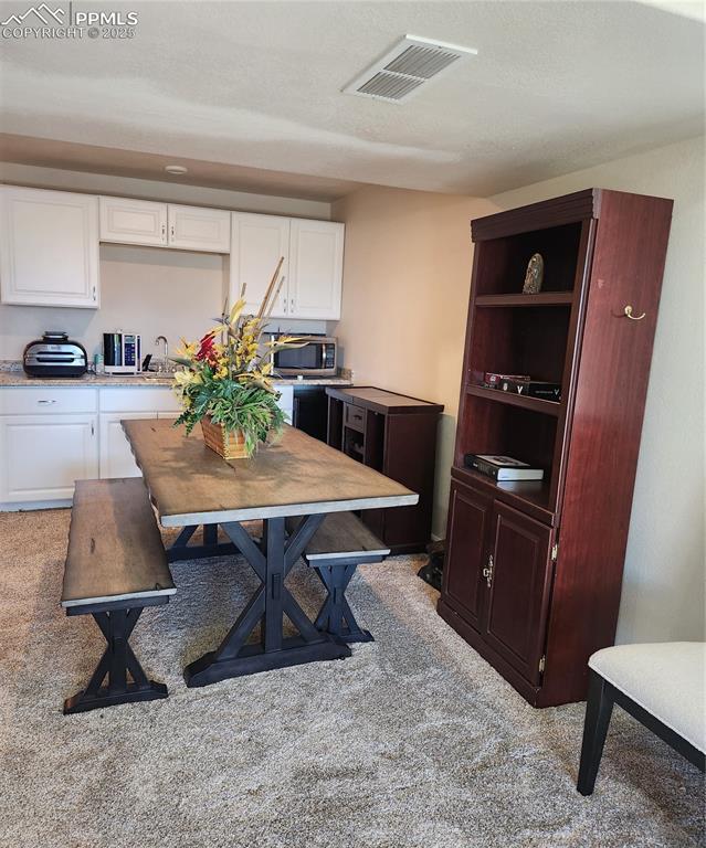 Wet bar with Dining area, rec room in basement