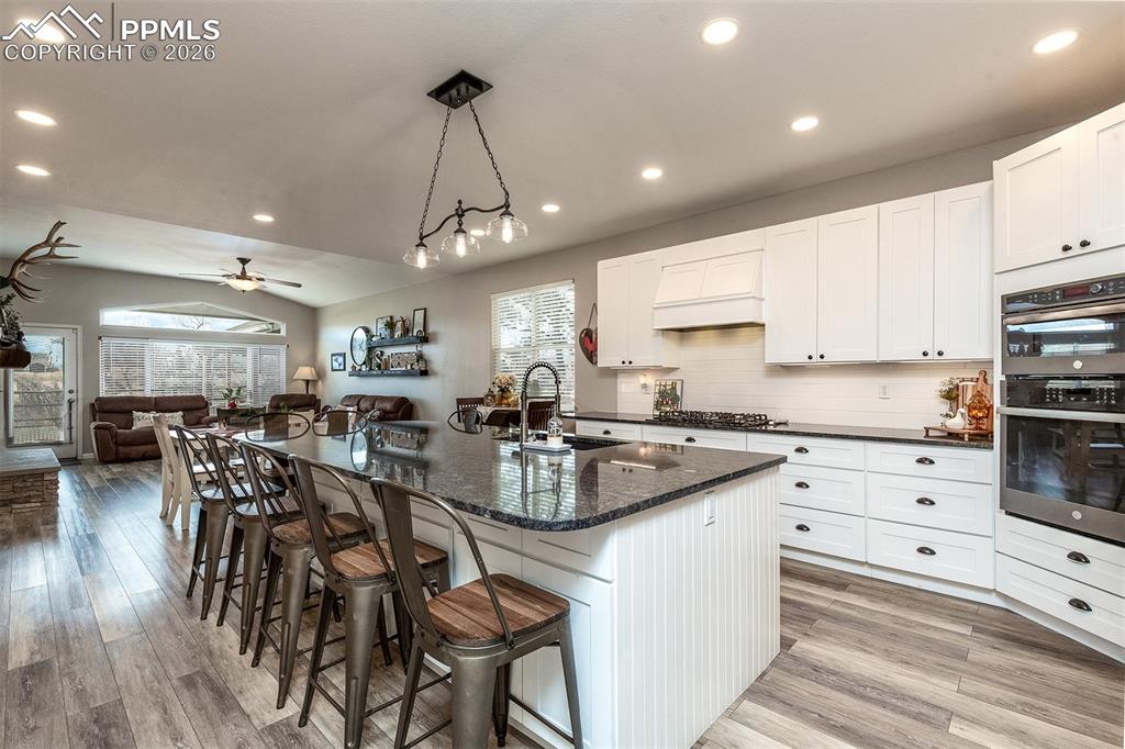 Host everyone in this beautiful, custom kitchen.