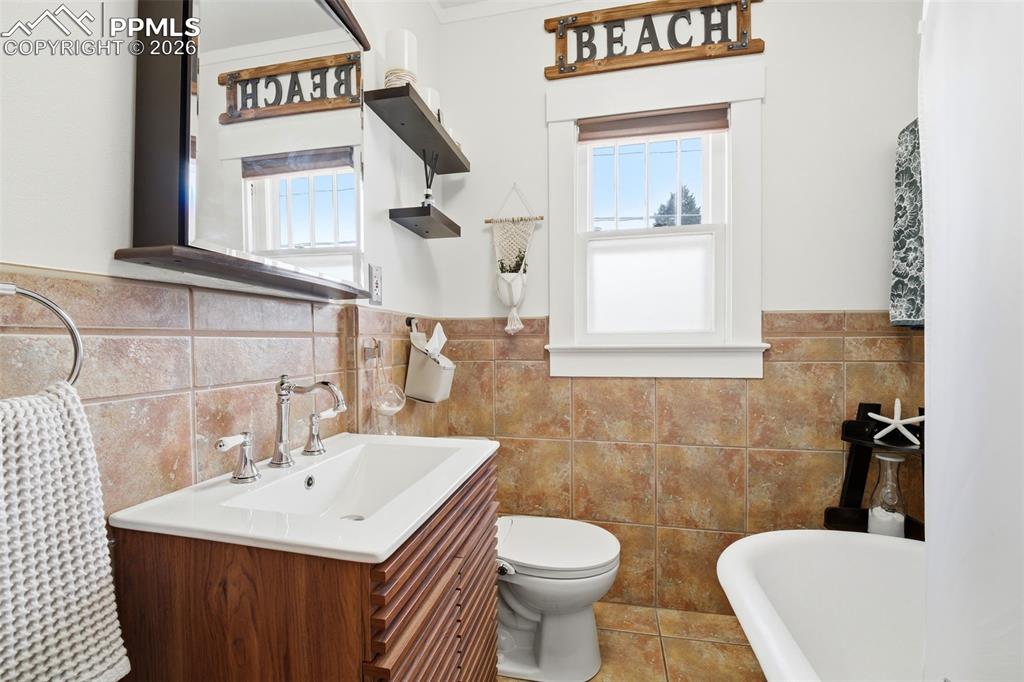 Updated Bathroom with Tile Floor and Clawfoot Tub/Shower combo