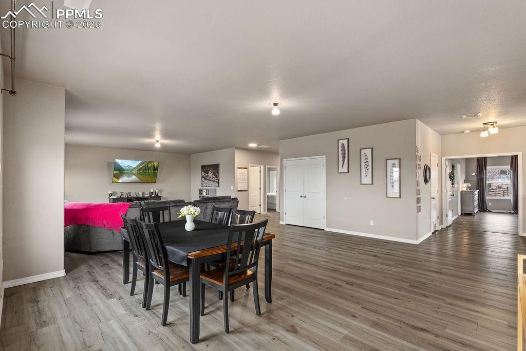 Family room with light wood-style floors and washer / dryer