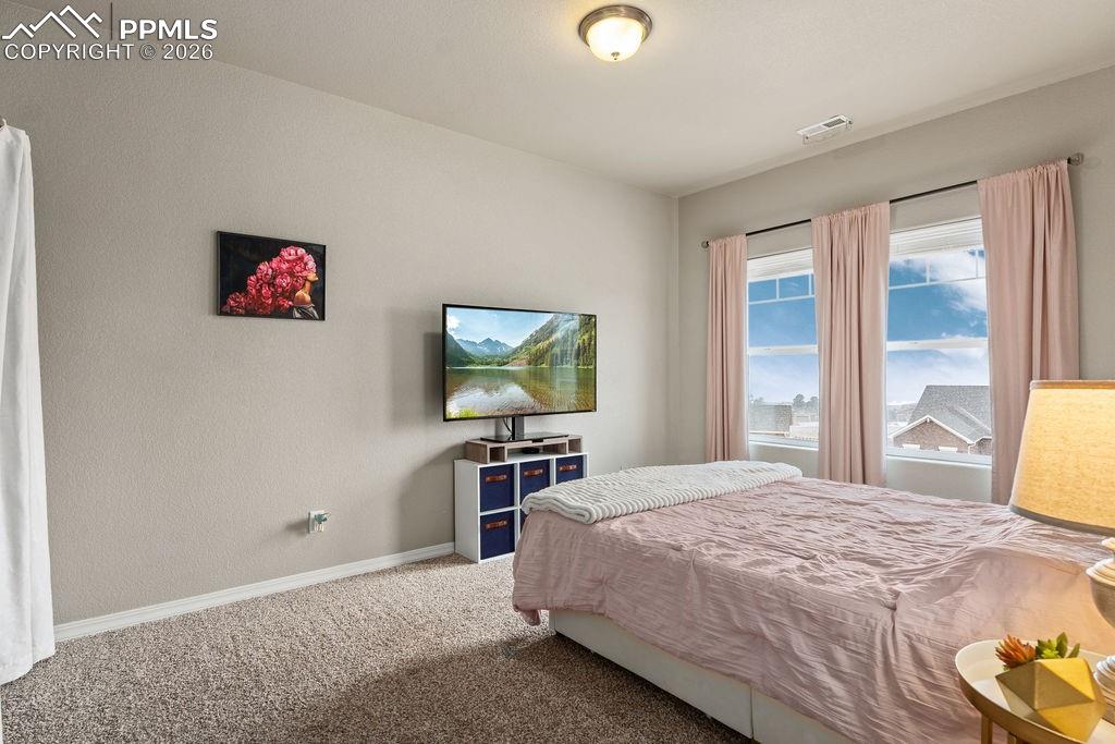 Upper floor bedroom #2 featuring west facing mountain views
