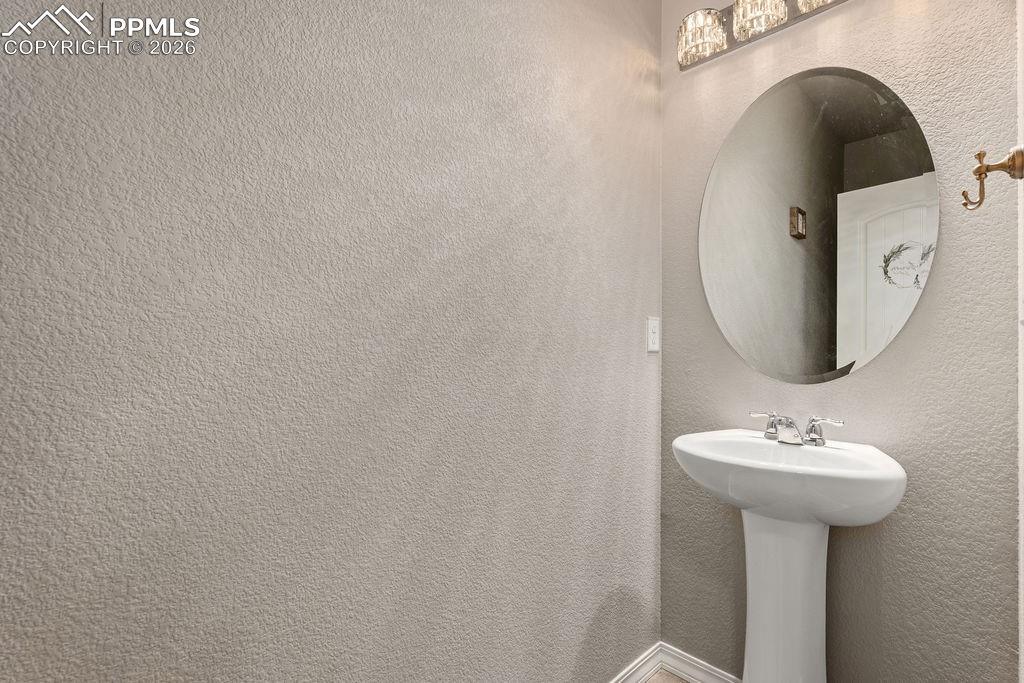 Bathroom featuring a textured wall