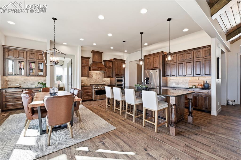 Chef's kitchen with custom cabinetry, large island and gas stove!