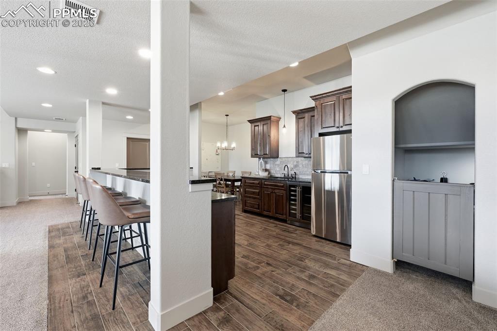 Spacious wet bar and kitchenette is larger than most kitchens!