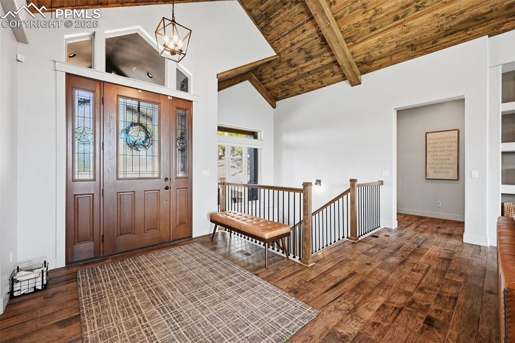 Beautiful entry with vaulted wood ceiling and natural light!