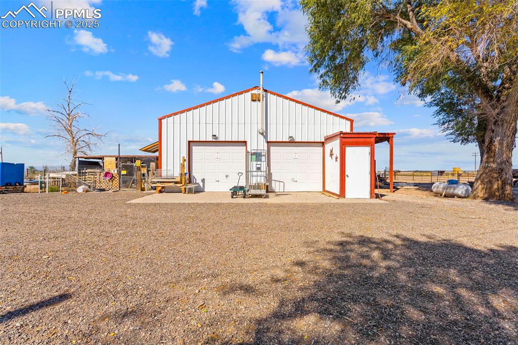 Extra spacious garage and workshop with 1/2 bath.