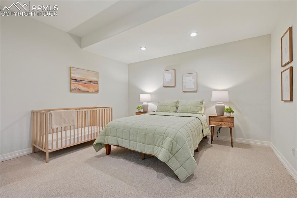 Bedroom featuring light colored carpet and recessed lighting