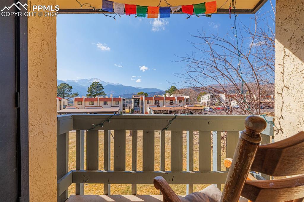 Balcony with a residential view and a mountain view