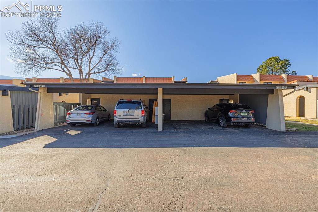 Garage featuring covered parking