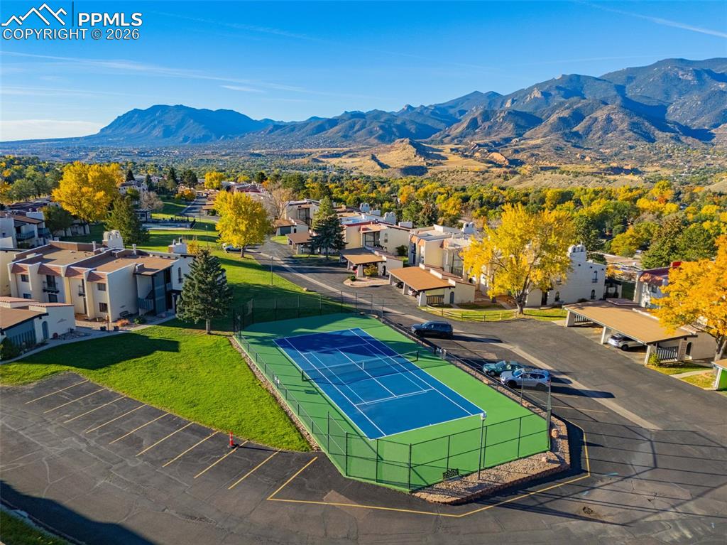 Aerial perspective of suburban area featuring a mountain backdrop