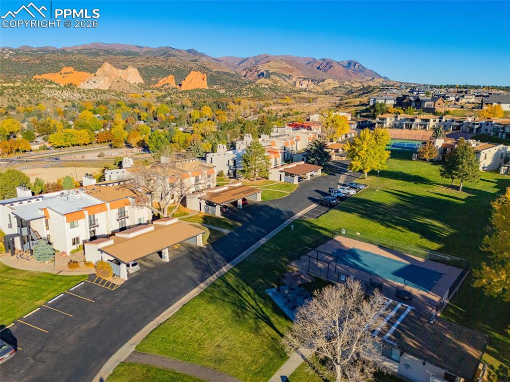 Aerial perspective of suburban area featuring a mountain backdrop