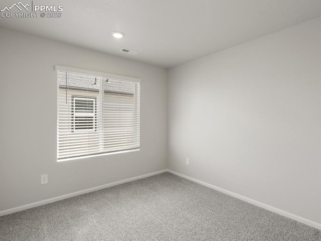 Unfurnished room featuring carpet and recessed lighting