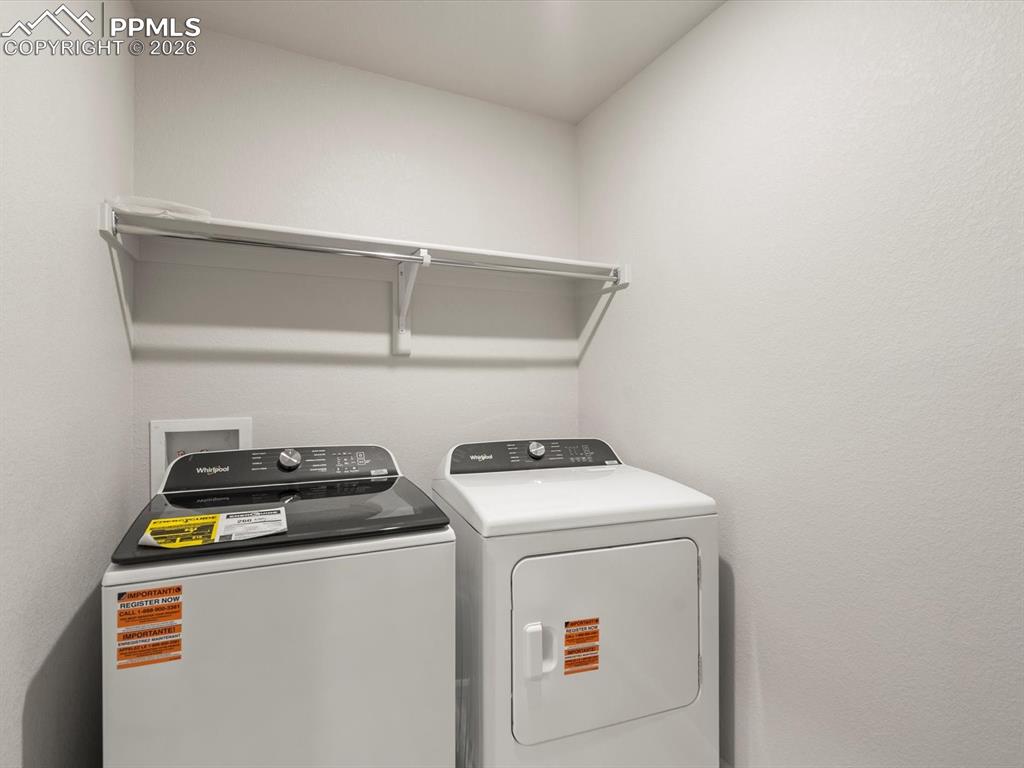 Laundry area featuring separate washer and dryer