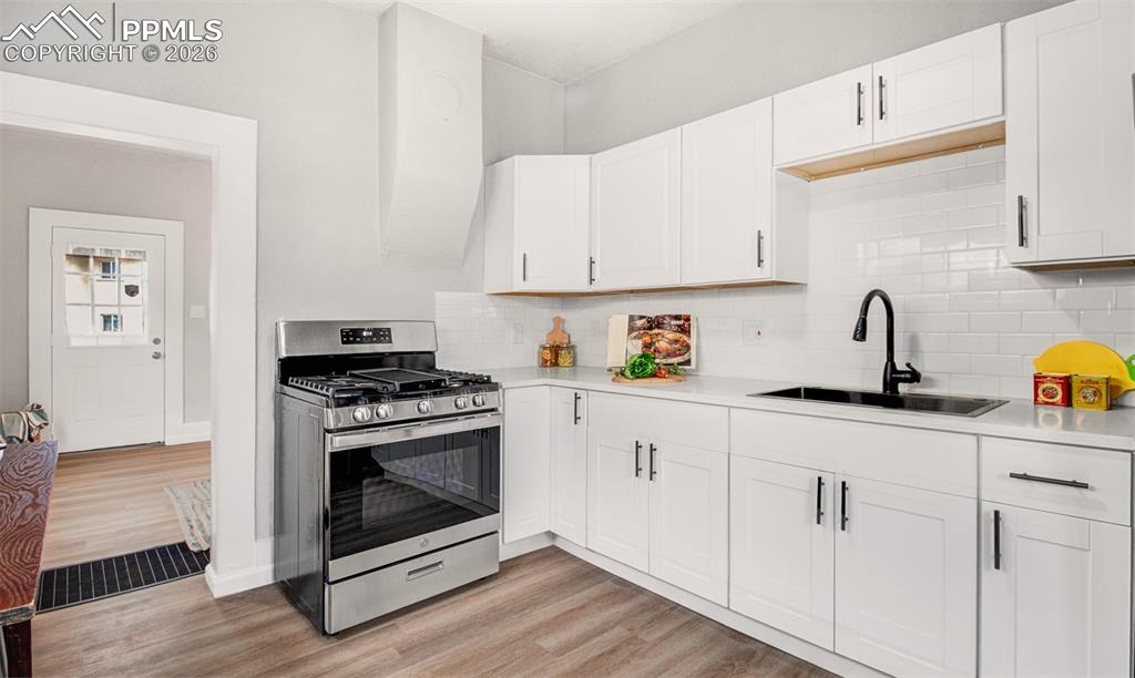 Quartz countertops and a gas range