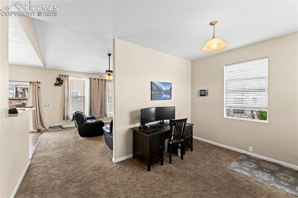 Office featuring carpet floors and ceiling fan