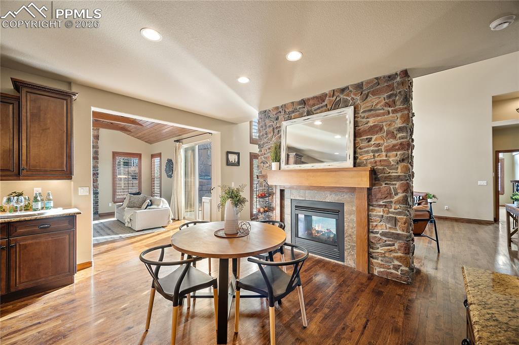 Eat-in kitchen area with fireplace. 