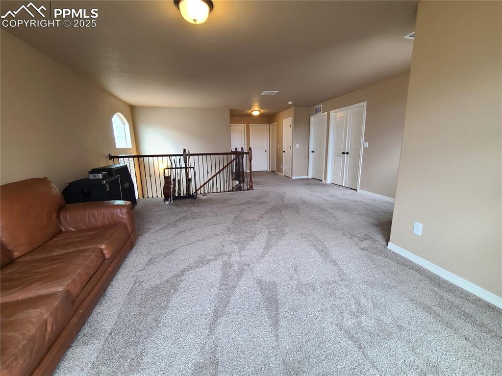 Living room with carpet and baseboards