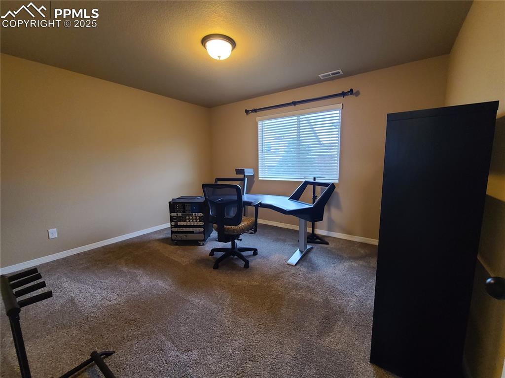 Office featuring carpet floors and baseboards