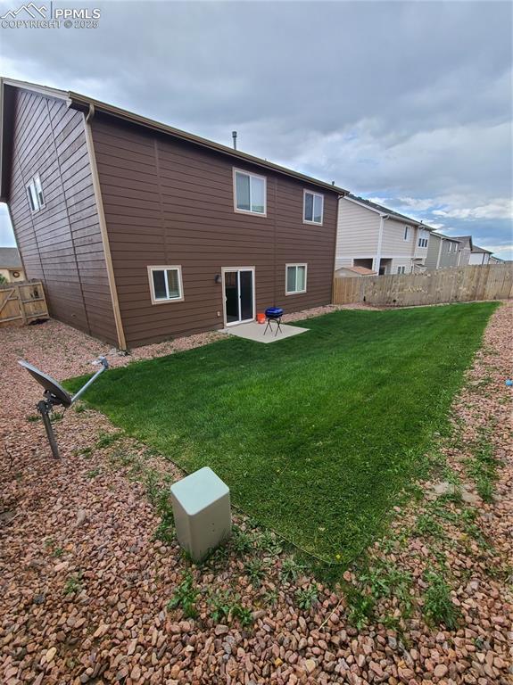 Back of property with a patio