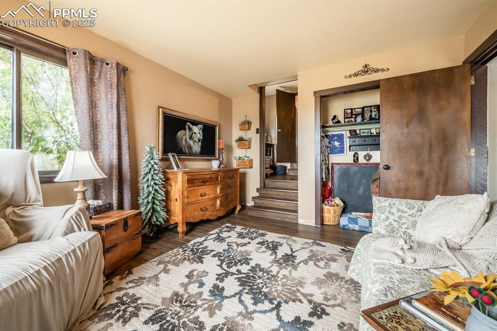 Living area with dark hardwood / wood-style floors