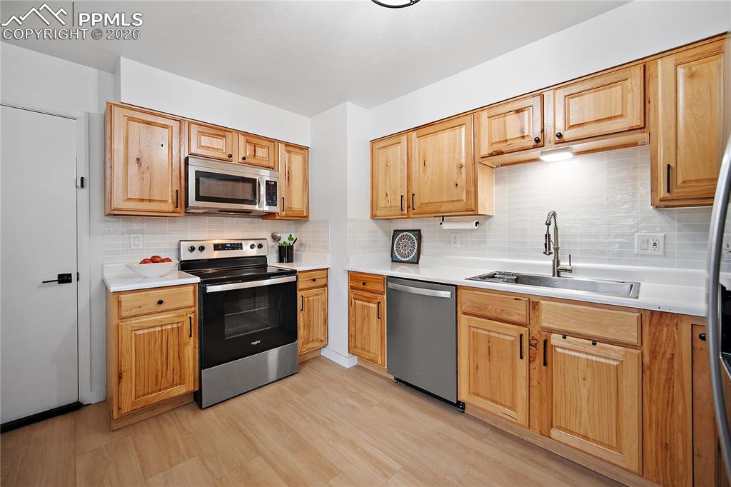 Kitchen with SS and newer cabinetry. 