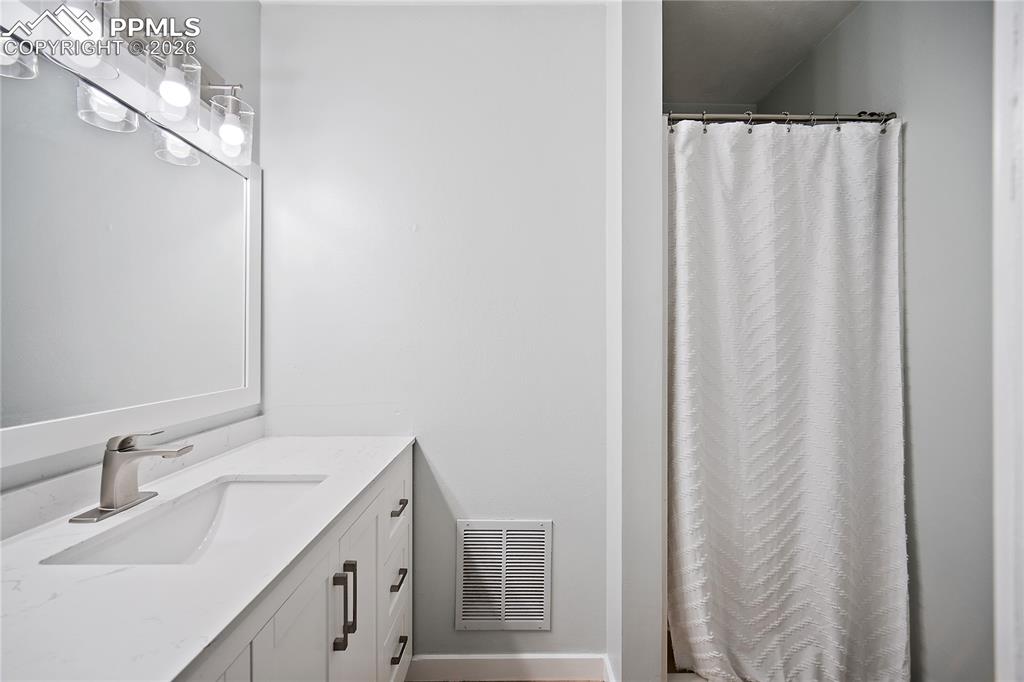 Ensuite bath with new vanity and lighting.