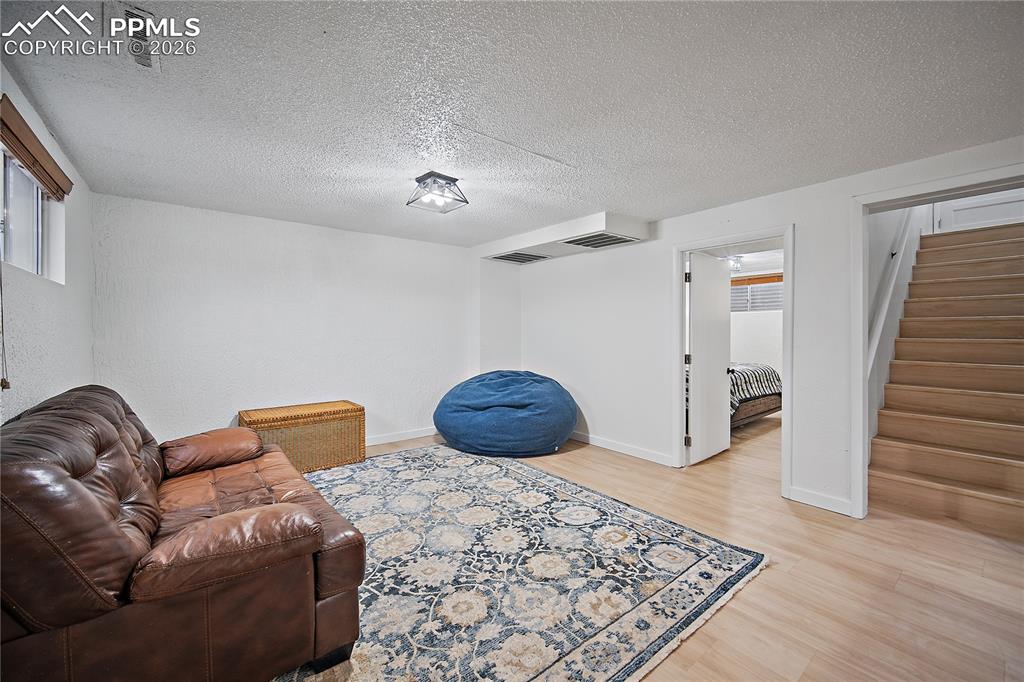 Basement family room with laminate flooring. 