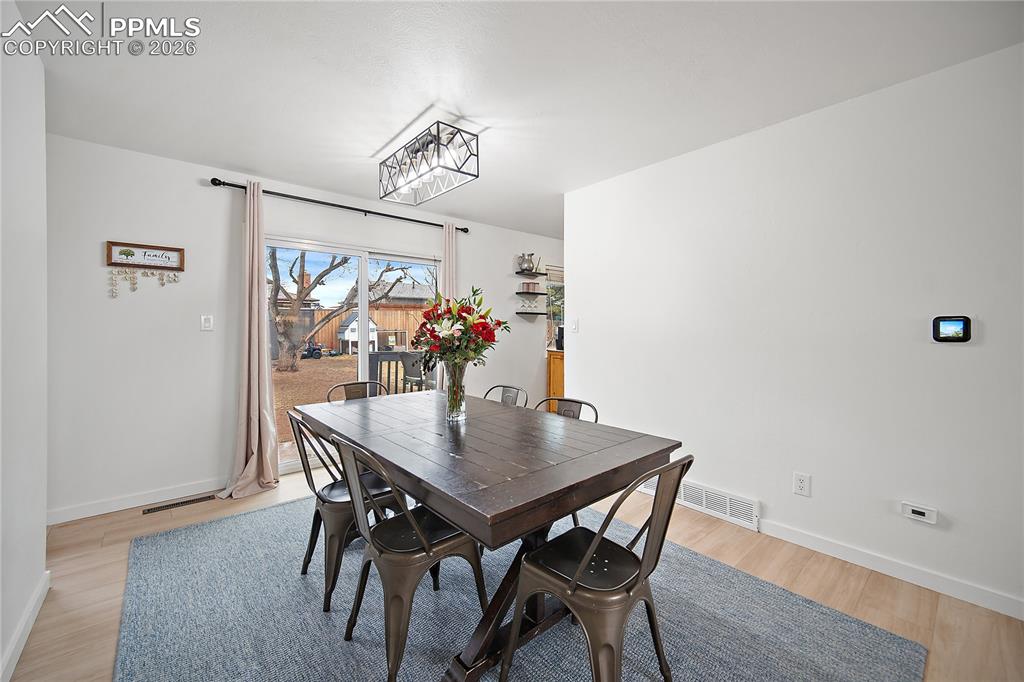 Dining room walks out to fully fenced back yard. 