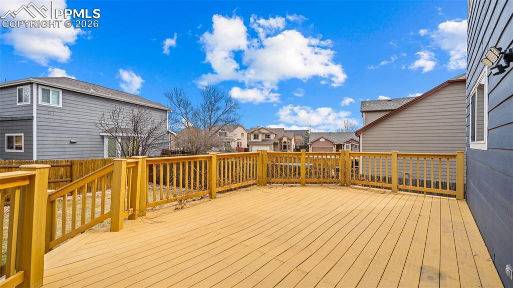 Wooden deck featuring a residential view