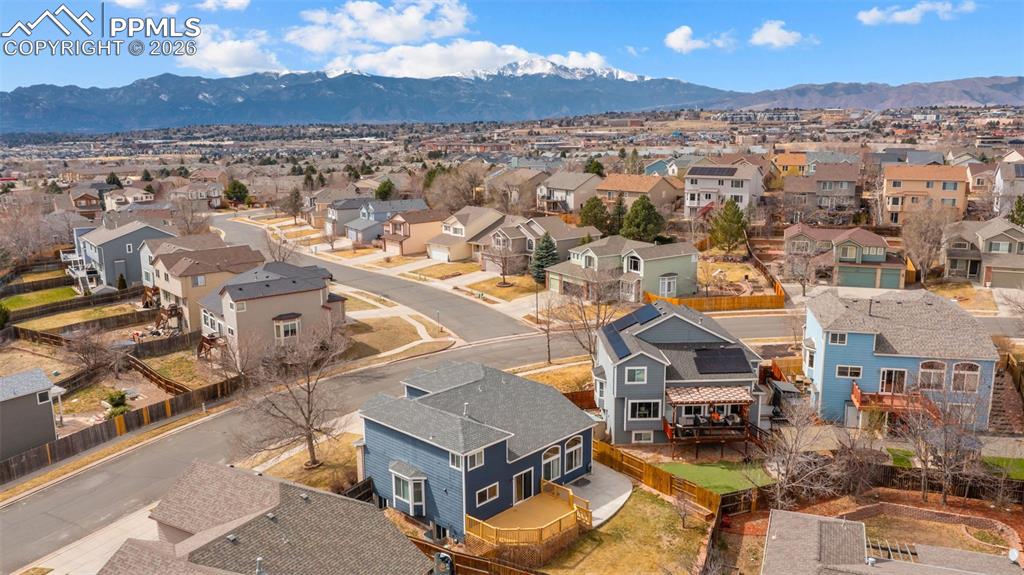 Aerial view of residential area featuring mountains