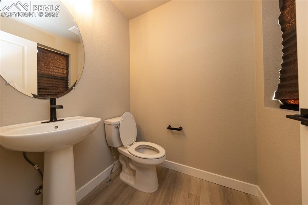 Bathroom with baseboards and light wood-style floors
