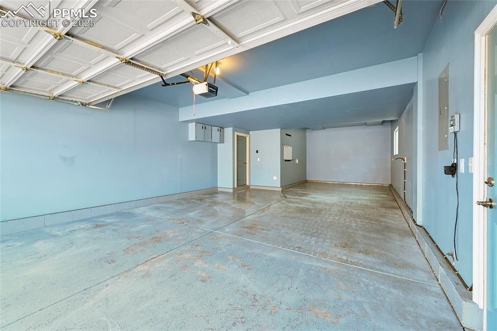 Garage featuring a garage door opener