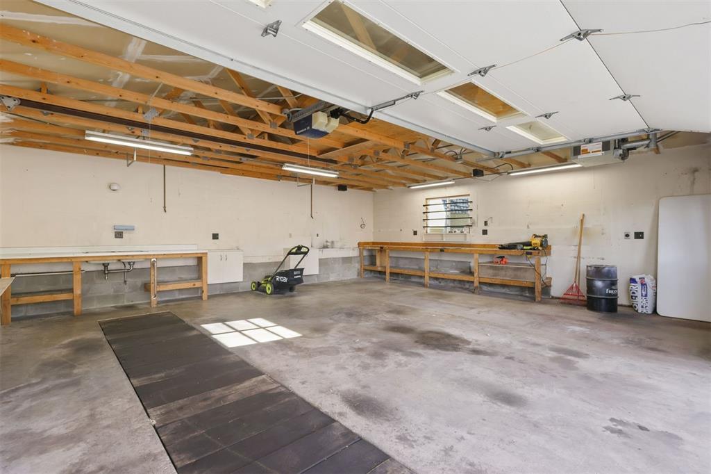 The heated garage features a vehicle inspection pit.