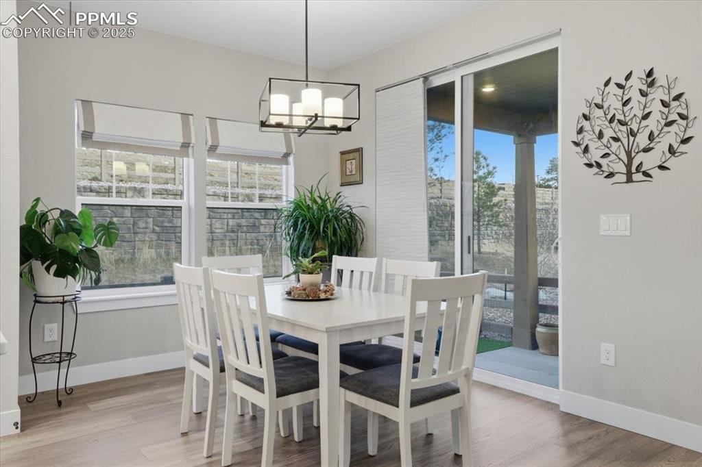 The dining area is open to the kitchen and has a walk-out to the patio.