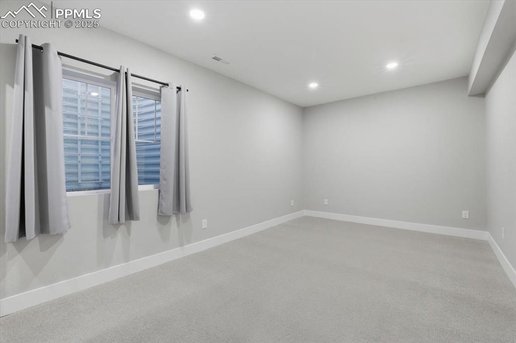 This fourth bedroom is also on the basement level bedroom and is nice and bright. 