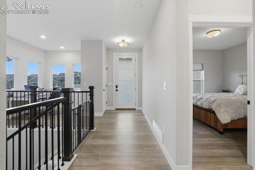 Welcome home! The entry of the home is well lit thanks to the glass inserts in the front door and the front windows in the office nook at the front of the home.