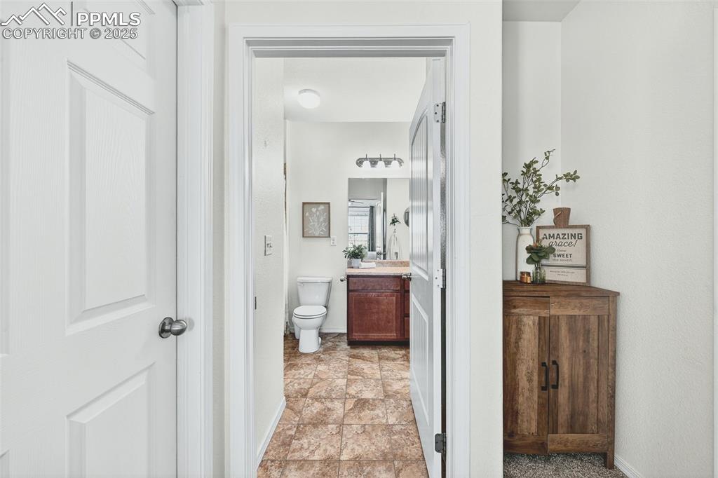 Bathroom featuring vanity and toilet