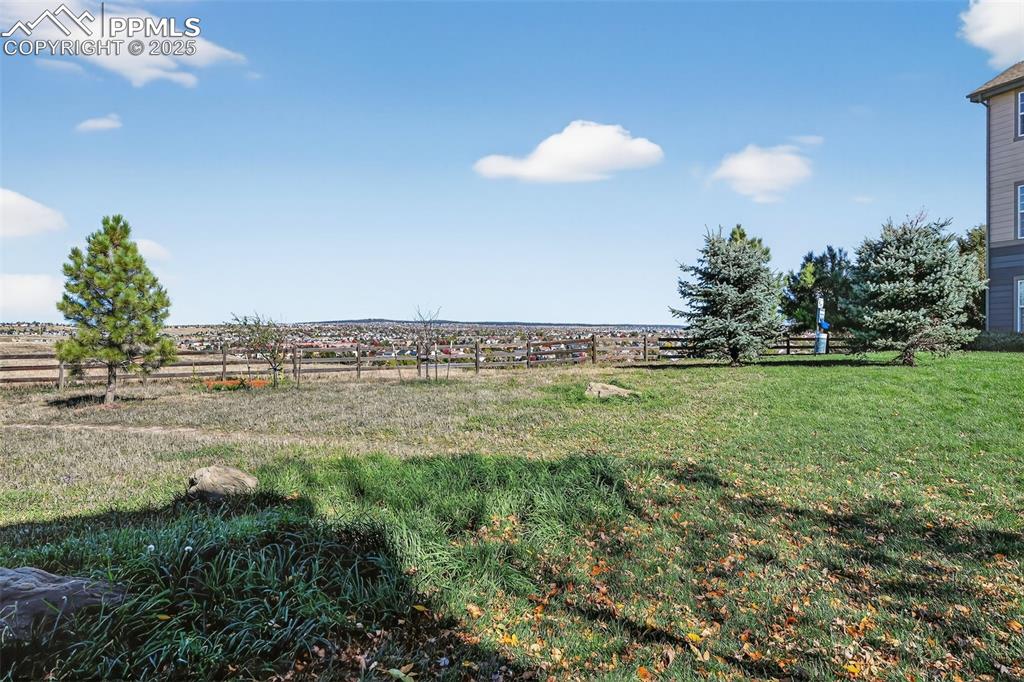 View of grass area that the condo backs to, featuring a view of countryside